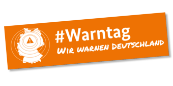 Banner des Warntags mit Deutschlandkarte und entsprechender Aufschrift.