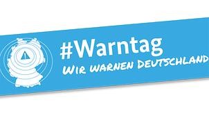 Banner des Warntags mit Deutschlandkarte und entsprechender Aufschrift.