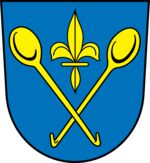 Quelle: Leo BW - wikipedia.de - SteveK In blau zwei gekreuzte goldene Löffel, die eine Lilie in der Mitte haben.