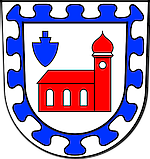 Rote Kapelle mit blauer Eichel in blauem Ornament