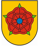 Quelle: Leo BW - wikipedia.de - Perhelion In Gold eine gefüllte blaubesamte rote Rose mit grünen Kelchblättern.